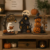 The Boo Crew Halloween decor set styled on an entryway console table with a 'home sweet home' sign, candle lantern, and faux pumpkins.